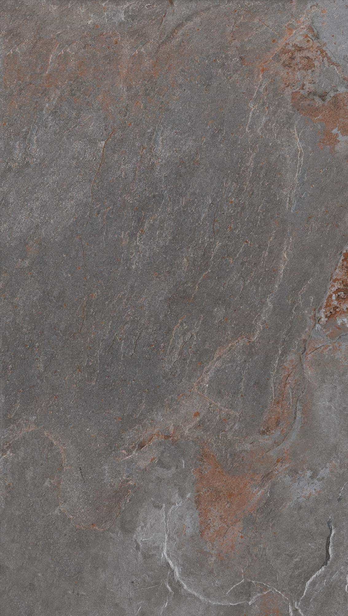 Close-up of Retrostone Matte 24x36x2cm Rectified Porcelain Paver from Stonelux. The paver features a natural stone appearance with subtle gray tones and earthy veining. Its matte finish offers a refined texture, ideal for patios and hardscape projects.