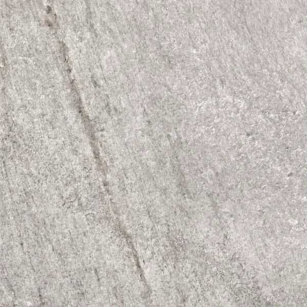 Close-up of Indiana Gris Matte 24x48x2cm Rectified Porcelain Paver by STONELUX, showcasing a subtle gray hue with natural stone-like texture. The matte finish highlights delicate veining, ideal for modern hardscape and pool projects.