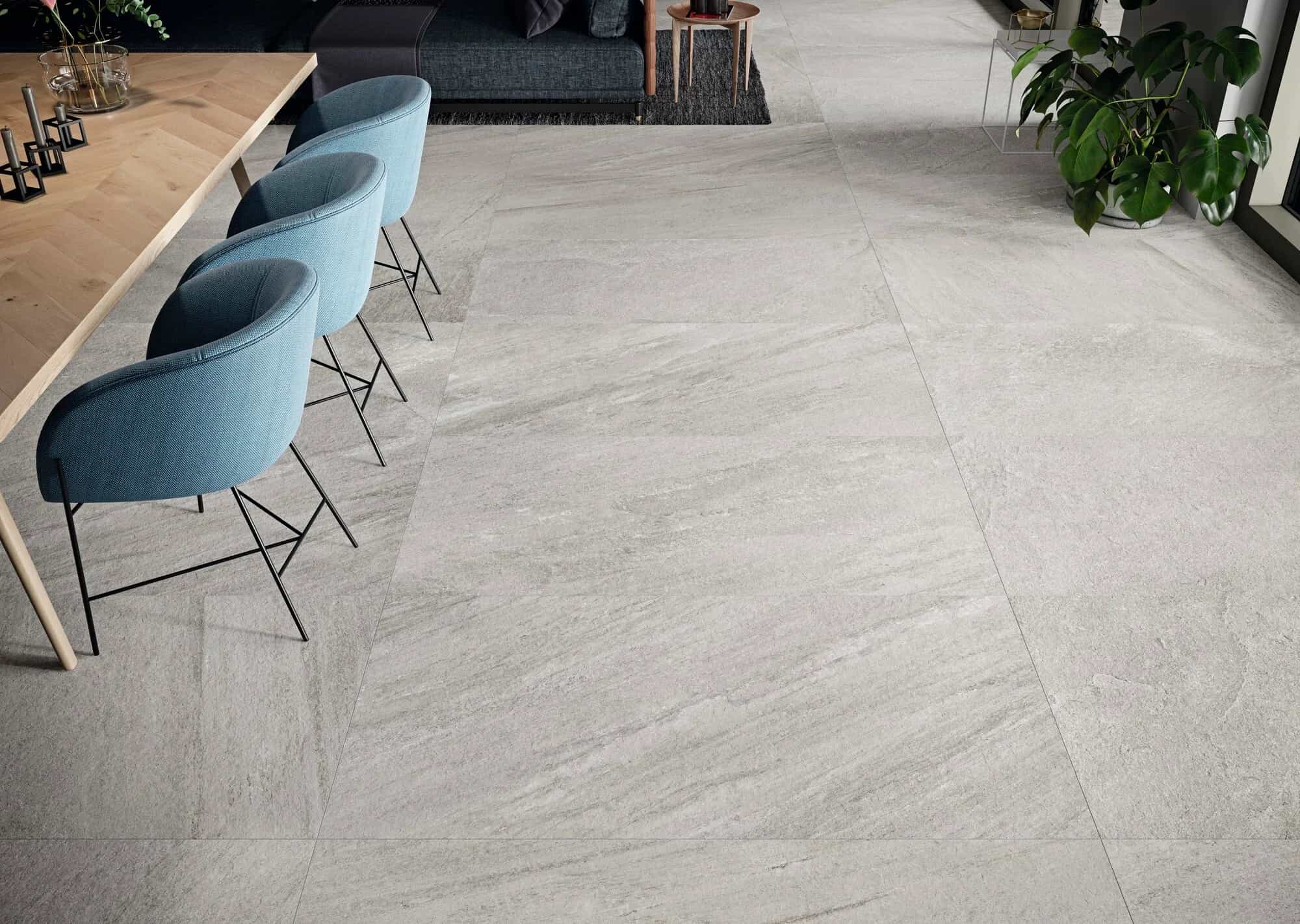 Indiana Gris Matte 24x48x2cm Rectified Porcelain Paver installed in a modern living space. The soft gray tones and subtle veining complement the sleek furniture. Ideal for contemporary interiors, highlighting the elegant matte finish and durable porcel...