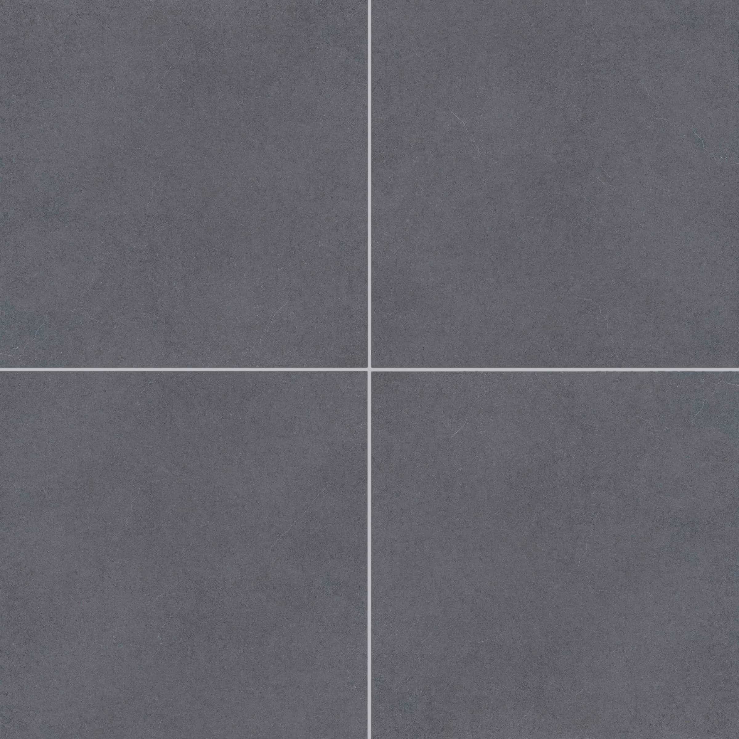 Close-up of the Silver Beach Matte 24x24x2cm Rectified Porcelain Paver from Stonelux. The paver features a smooth, matte finish with a subtle, uniform gray tone, ideal for modern hardscape projects. Perfect for patios, pool decks, and outdoor flooring.