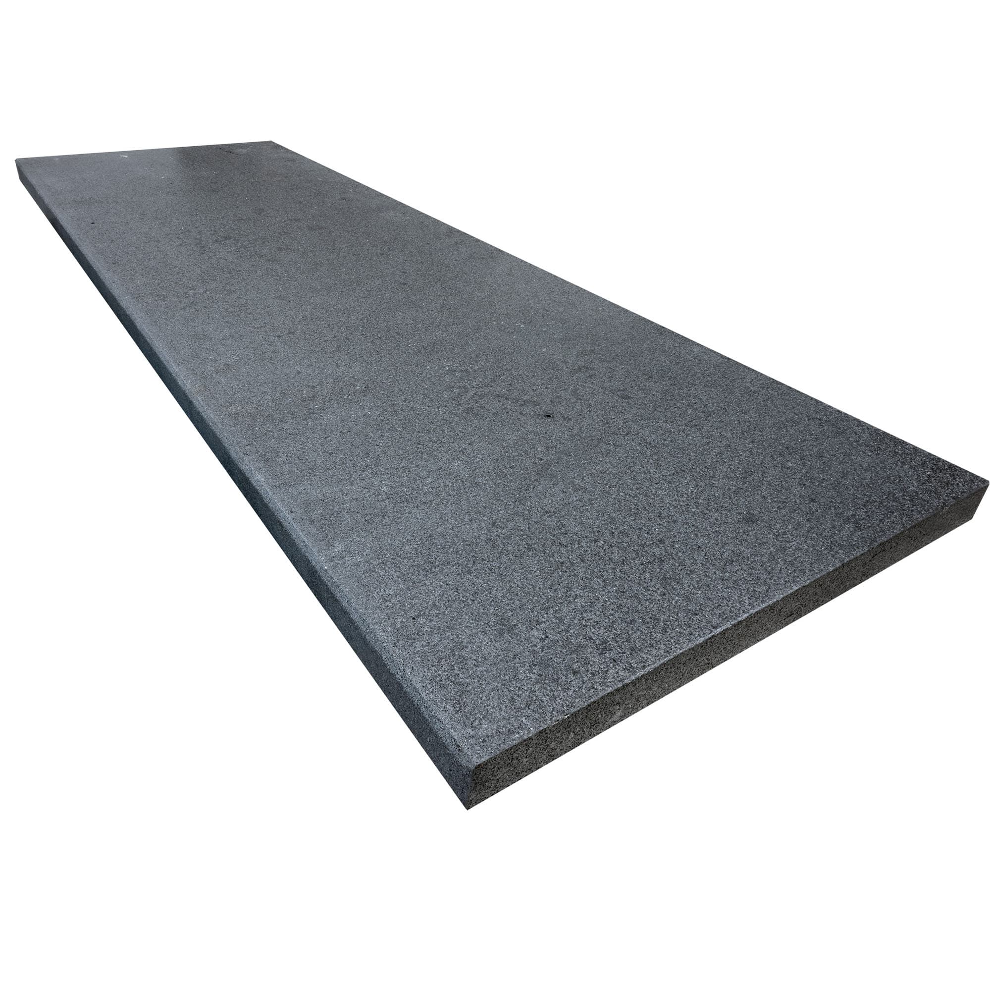 Close-up of Black Basalt Brushed 24x72x2 Eased Edge Tread, showcasing its tumbled and brushed finish. The natural stone exhibits a dark, sleek texture, ideal for modern hardscape projects. Perfect for pool coping or patio installations.