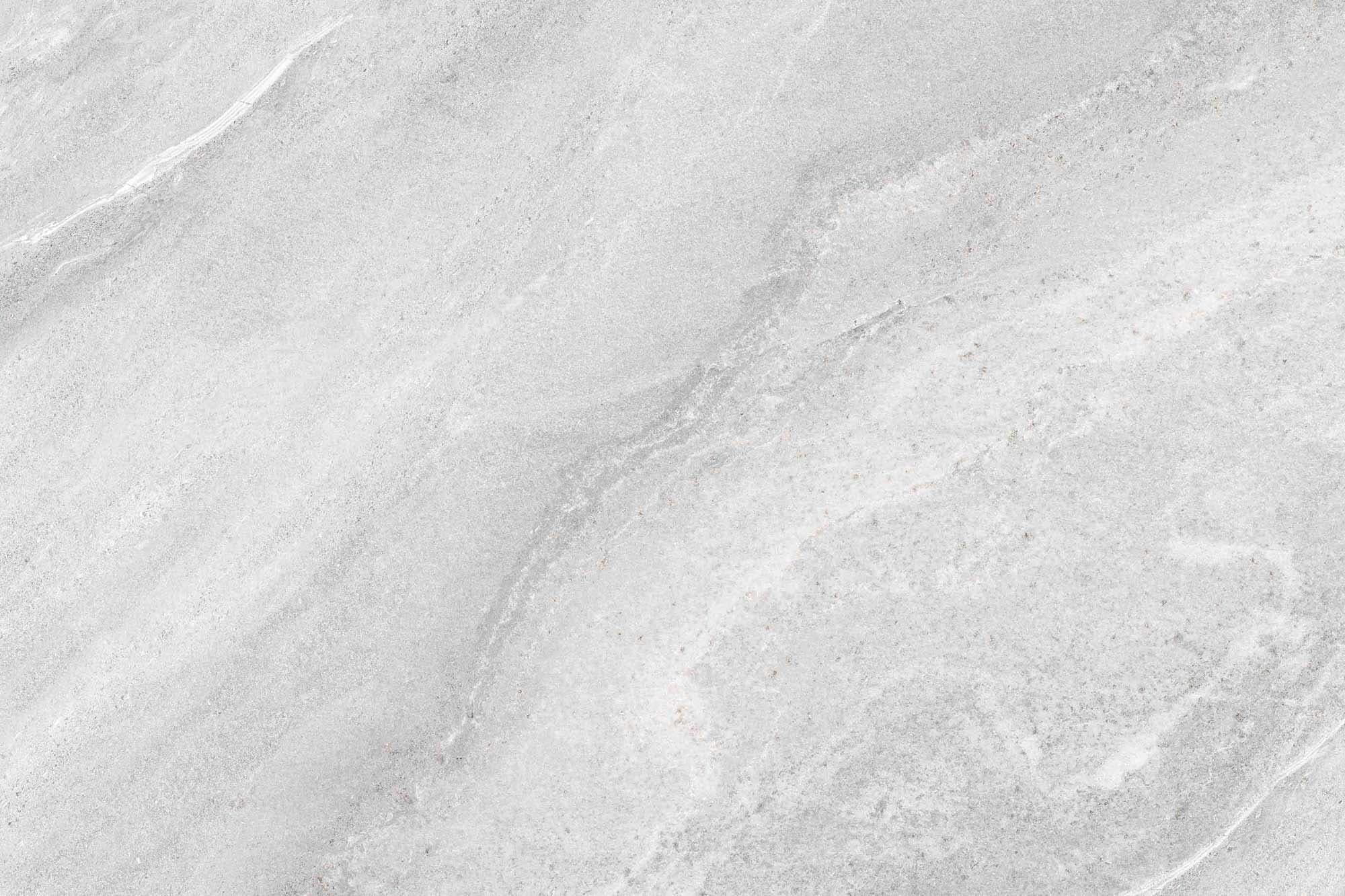 Close-up of the Nordstone Ice Matte 24x36x2cm Rectified Porcelain Paver, showcasing its smooth matte finish and subtle gray veining. This premium porcelain paver from the Porcelain Pavers collection offers a natural stone look ideal for modern hardscap...