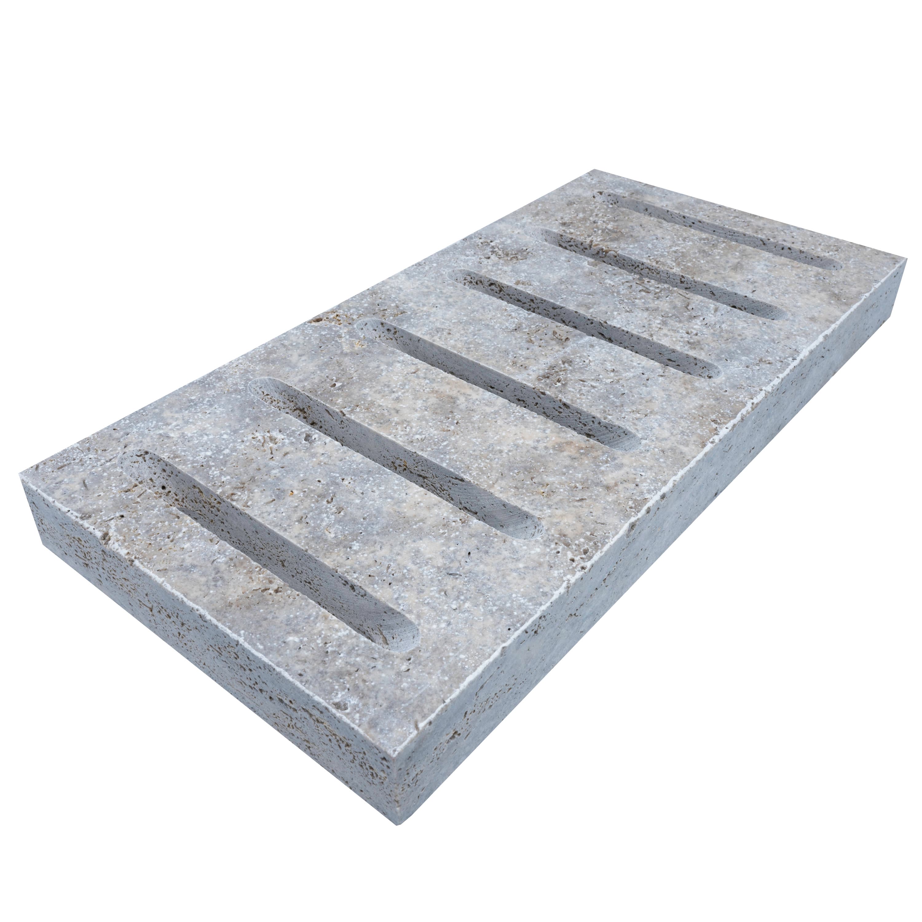 Close-up of Silver Travertine Tumbled 6x12x3cm Drain Decor - Premium, showcasing its natural stone texture, subtle silver hues, and tumbled finish. Ideal for hardscape projects, the travertine displays distinctive veining and a durable, elegant surface.