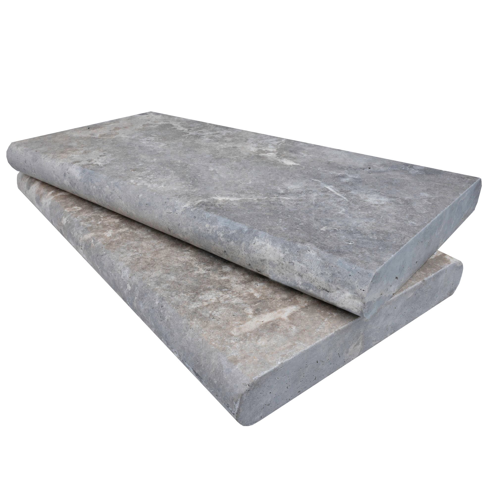 Close-up of Silver Travertine Tumbled 12x24x2 Double Bullnose Coping. This premium natural stone features a soft, tumbled finish with subtle gray veining, ideal for pool edges or patio designs. Perfect for elegant, durable hardscape projects.