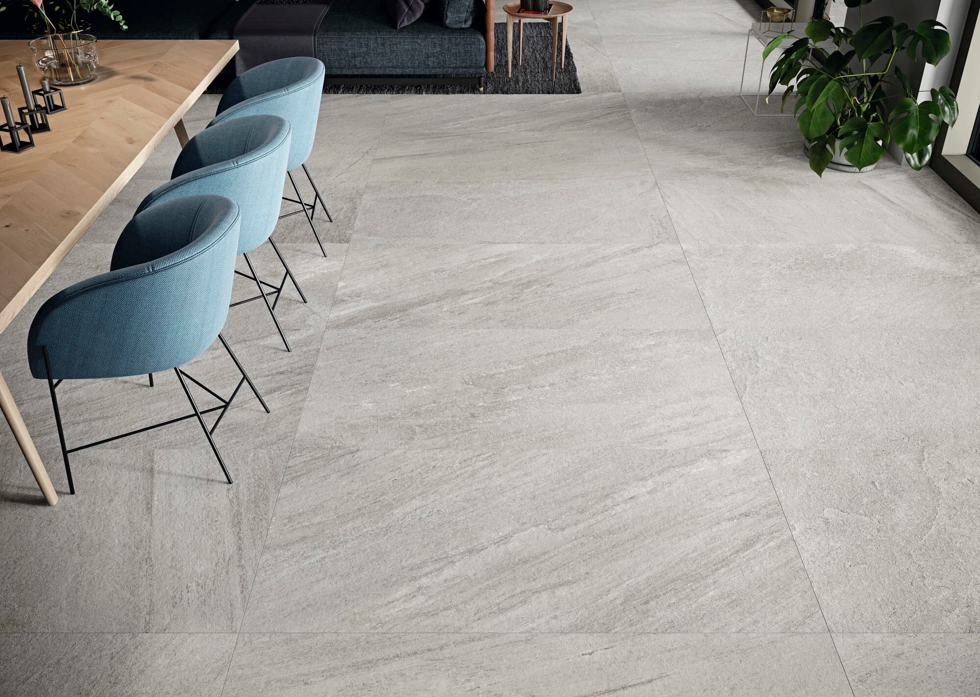 Indiana Gris Matte 24x48x2cm Rectified Porcelain Paver installed in a modern living space. The soft gray tones and subtle veining complement the sleek furniture. Ideal for contemporary interiors, highlighting the elegant matte finish and durable porcel...
