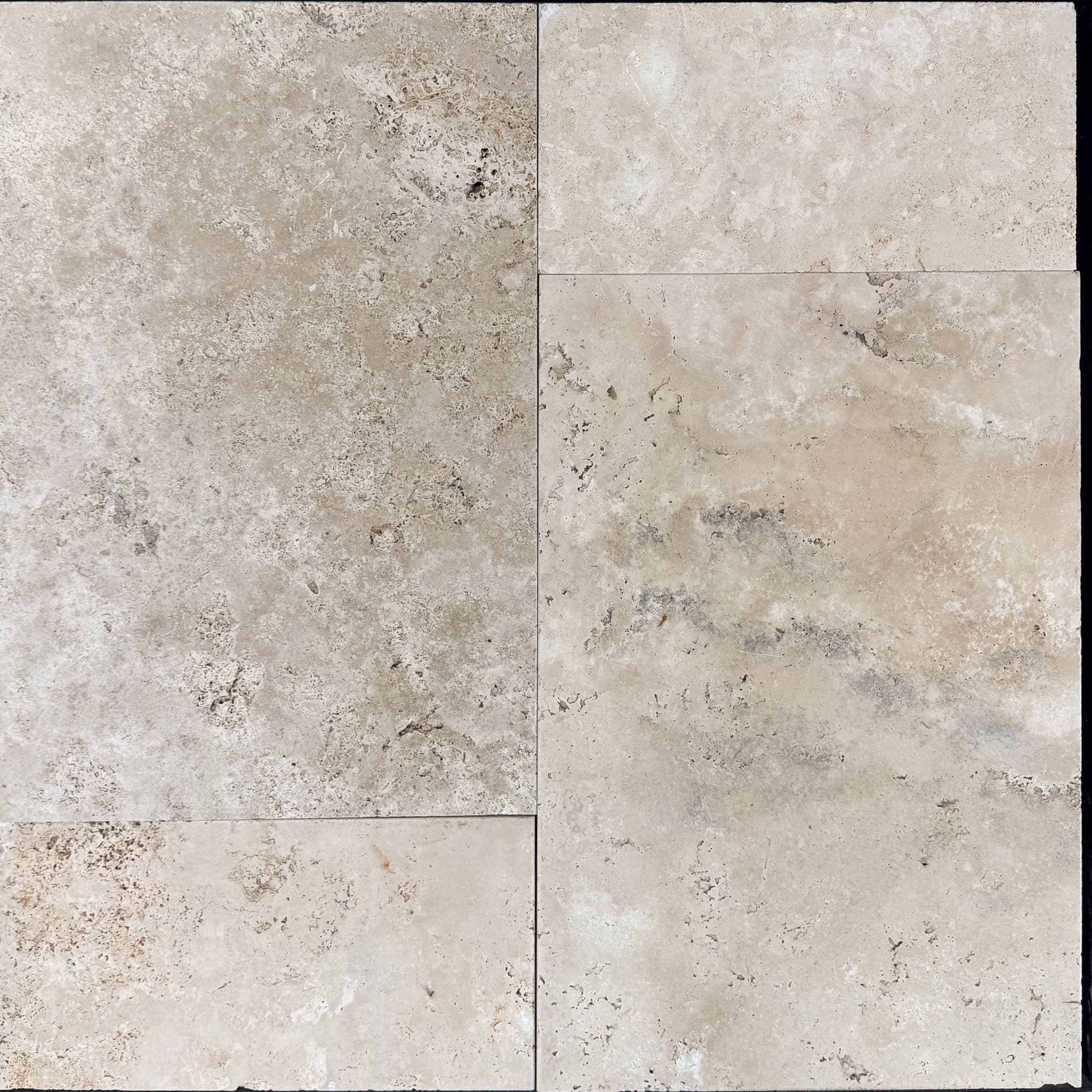 Close-up of Ivory Travertine Tumbled French Pattern 3cm Paver by STONELUX, showcasing its natural stone texture. The paver features a soft beige tone with subtle veining and a tumbled finish, perfect for elegant pool decks and patios.
