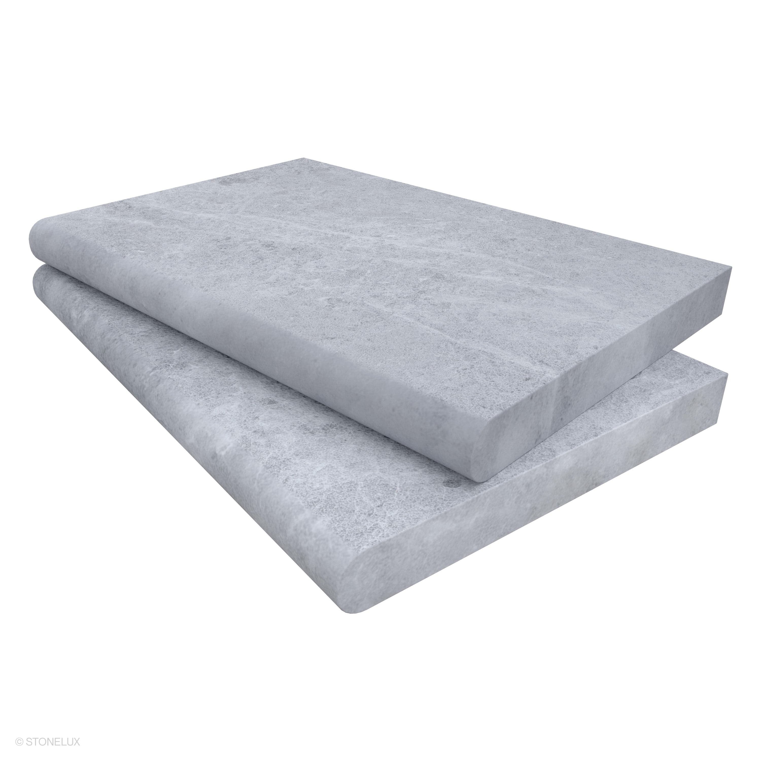 Tundra Grey Marble Sand Blasted 16x24x2 Single Bullnose Coping by STONELUX. This marble coping features a sandblasted finish with subtle grey veining, ideal for pool edges or wall caps. The 2-inch thickness and smooth bullnose edge ensure durability an...