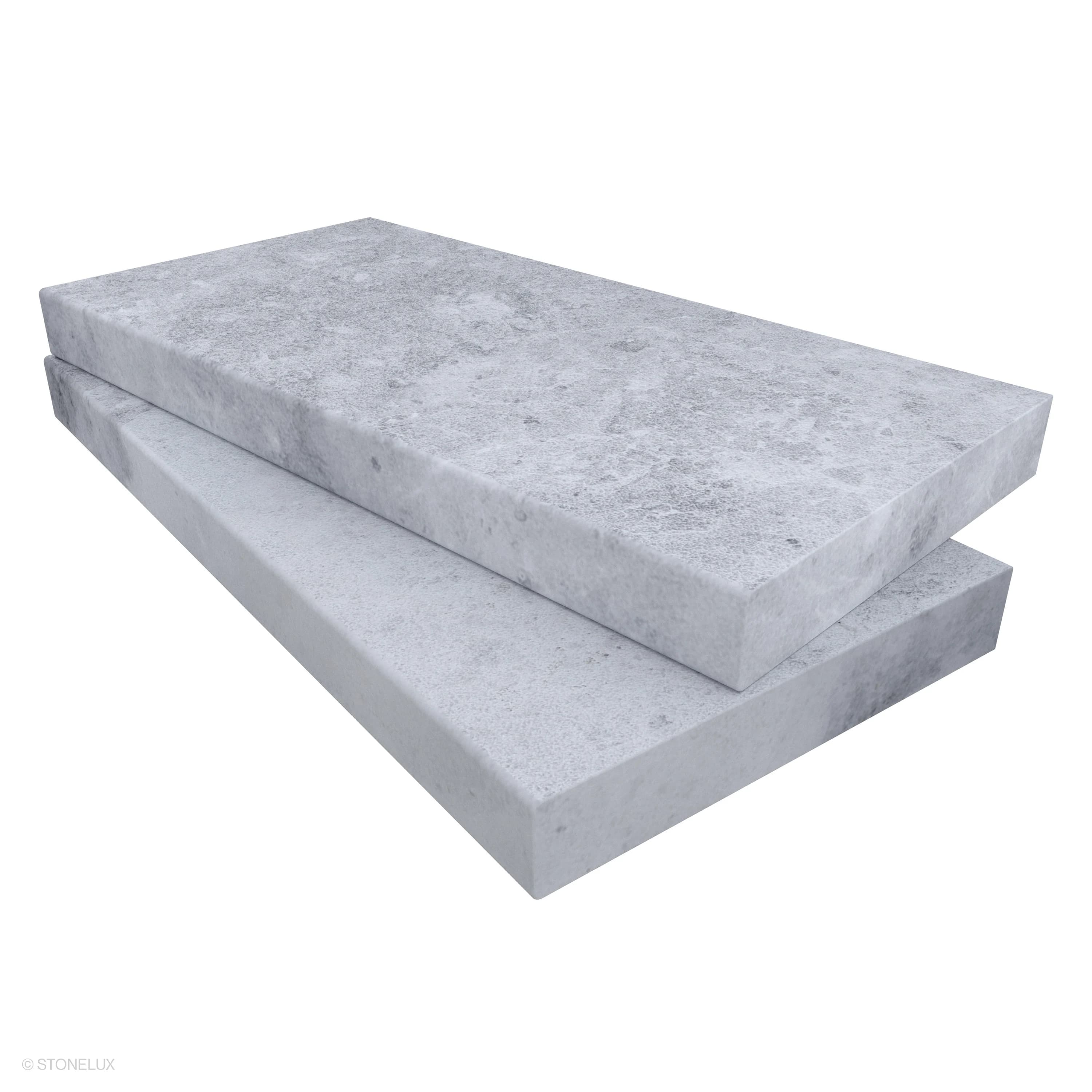 Tundra Grey Marble Sand Blasted 12x24x2 Eased Edge Coping by STONELUX displayed in close-up. Featuring a textured, sandblasted surface with subtle grey veining, this marble coping is ideal for pool edges or wall caps, offering a sleek, modern look.
