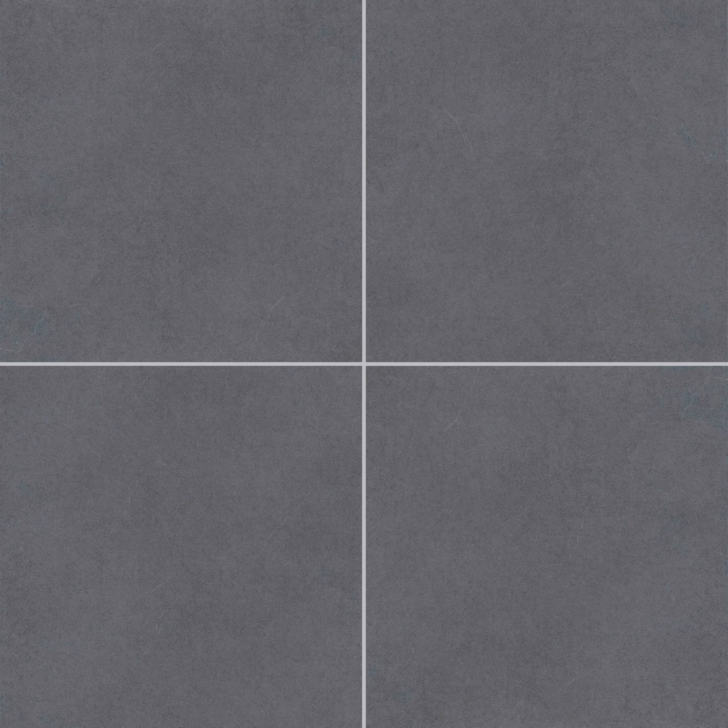 Close-up of the Silver Beach Matte 24x24x2cm Rectified Porcelain Paver from Stonelux. The paver features a smooth, matte finish with a subtle, uniform gray tone, ideal for modern hardscape projects. Perfect for patios, pool decks, and outdoor flooring.
