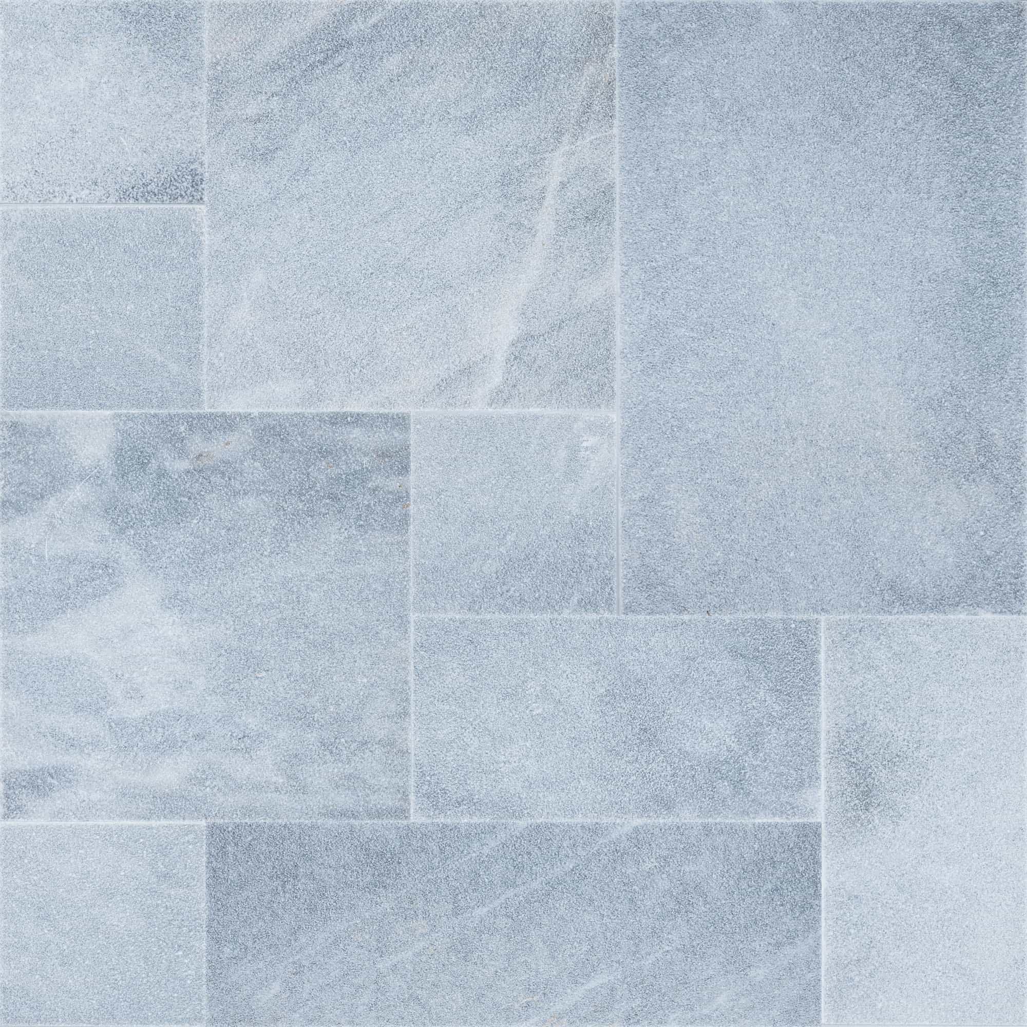Close-up of Arctic Grey Marble Sand Blasted French Pattern 3cm Paver by STONELUX. The marble paver features a subtle grey hue with a sandblasted finish, showcasing fine texture and natural veining, ideal for elegant hardscape designs.