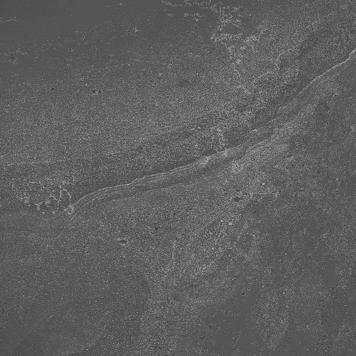 Close-up of British Stone (Premium Kandla) Anthracite Matte 24x24x2cm Rectified Porcelain Paver, showcasing its dark gray tone with subtle veining and a smooth matte finish. Ideal for hardscape projects, offering a natural stone look with durable porce...