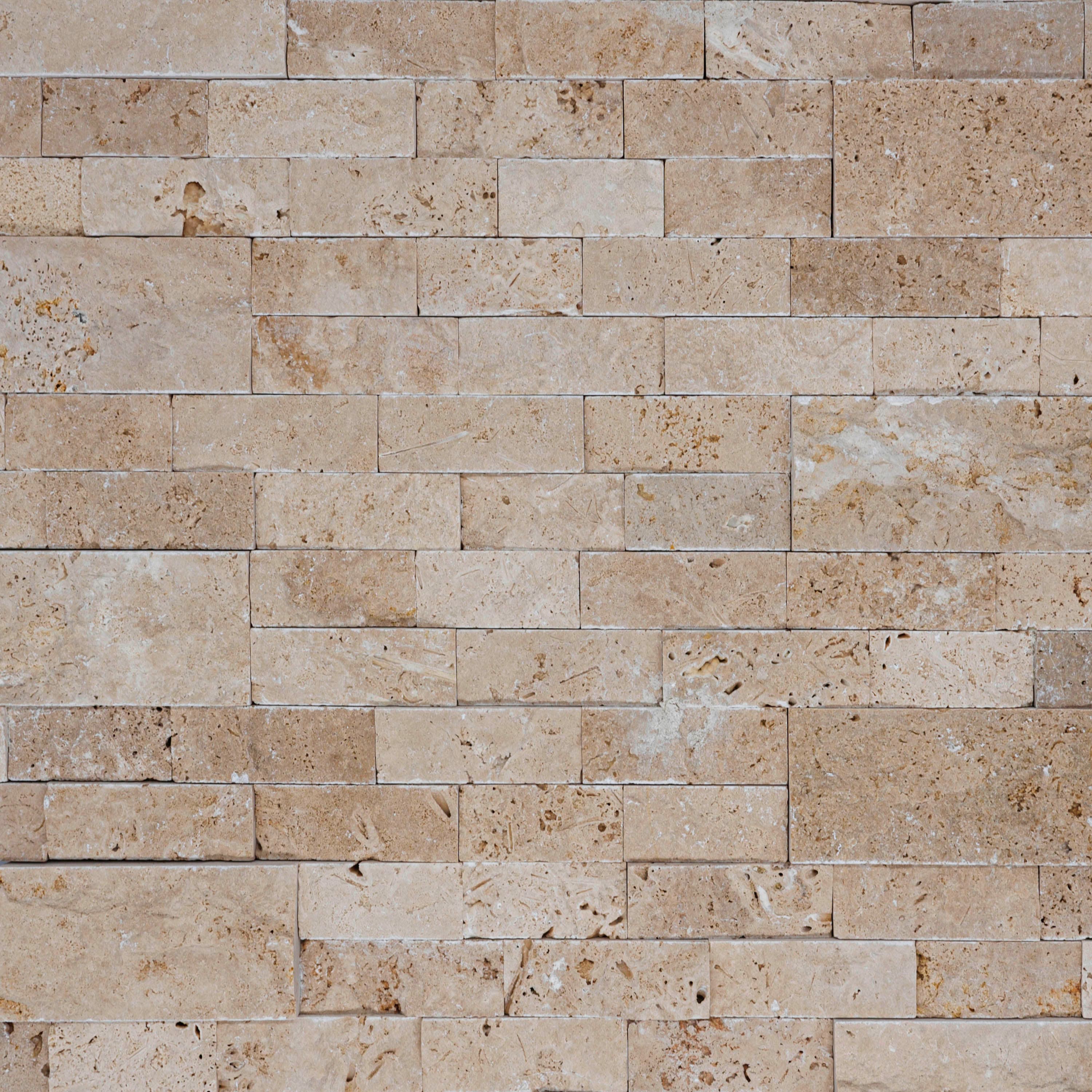Ivory Travertine Splitface Ledger Panel 6x24 close-up showcases natural stone's rich texture with subtle beige and cream tones, unique veining, and a rugged splitface finish, ideal for elegant wall cladding, enhancing both modern and traditional designs.