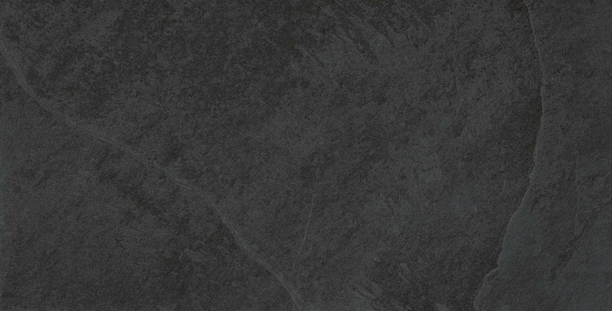Close-up of the Overland Anthracite Matte 24x48x2cm Rectified Porcelain Paver showcasing its dark gray tone and subtle textured finish. Ideal for modern outdoor spaces, this porcelain paver offers a sleek, natural stone appearance for patios and pool d...