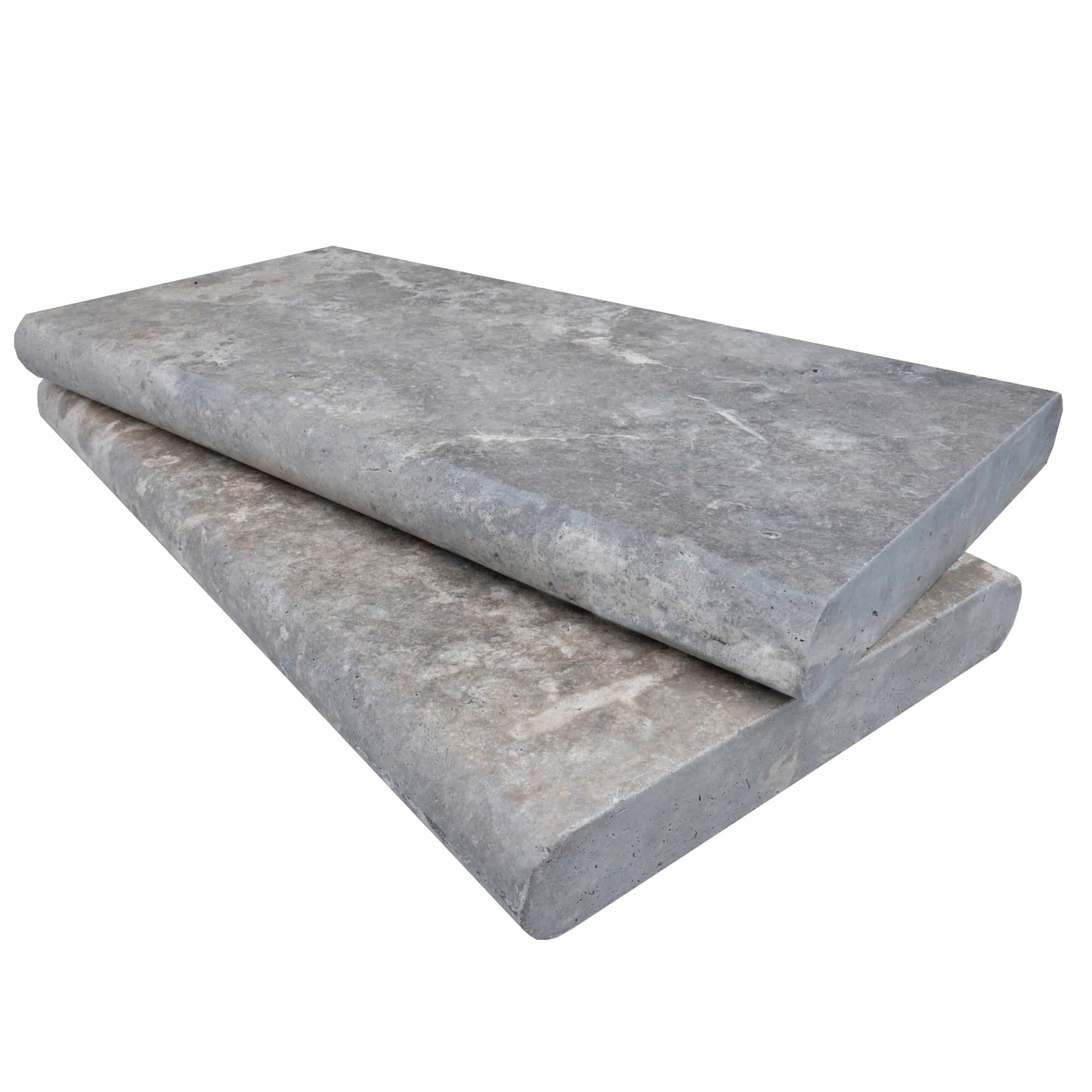 Close-up of Silver Travertine Tumbled 12x24x2 Double Bullnose Coping. This premium natural stone features a soft, tumbled finish with subtle gray veining, ideal for pool edges or patio designs. Perfect for elegant, durable hardscape projects.