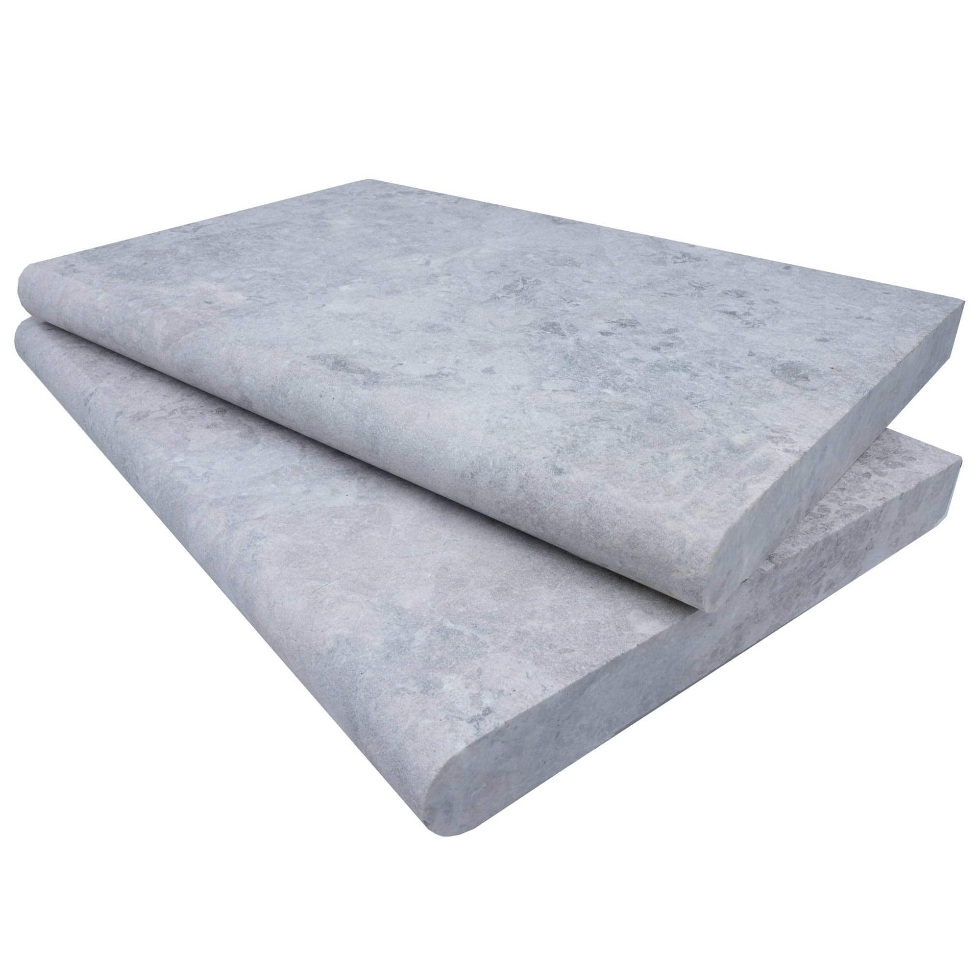 Tundra Grey Marble Sand Blasted 16x24x2 Single Bullnose Coping close-up, showcasing the smooth, sandblasted texture with subtle grey veining. Ideal for pool and patio projects, this natural stone offers a sleek, modern finish for hardscape designs.