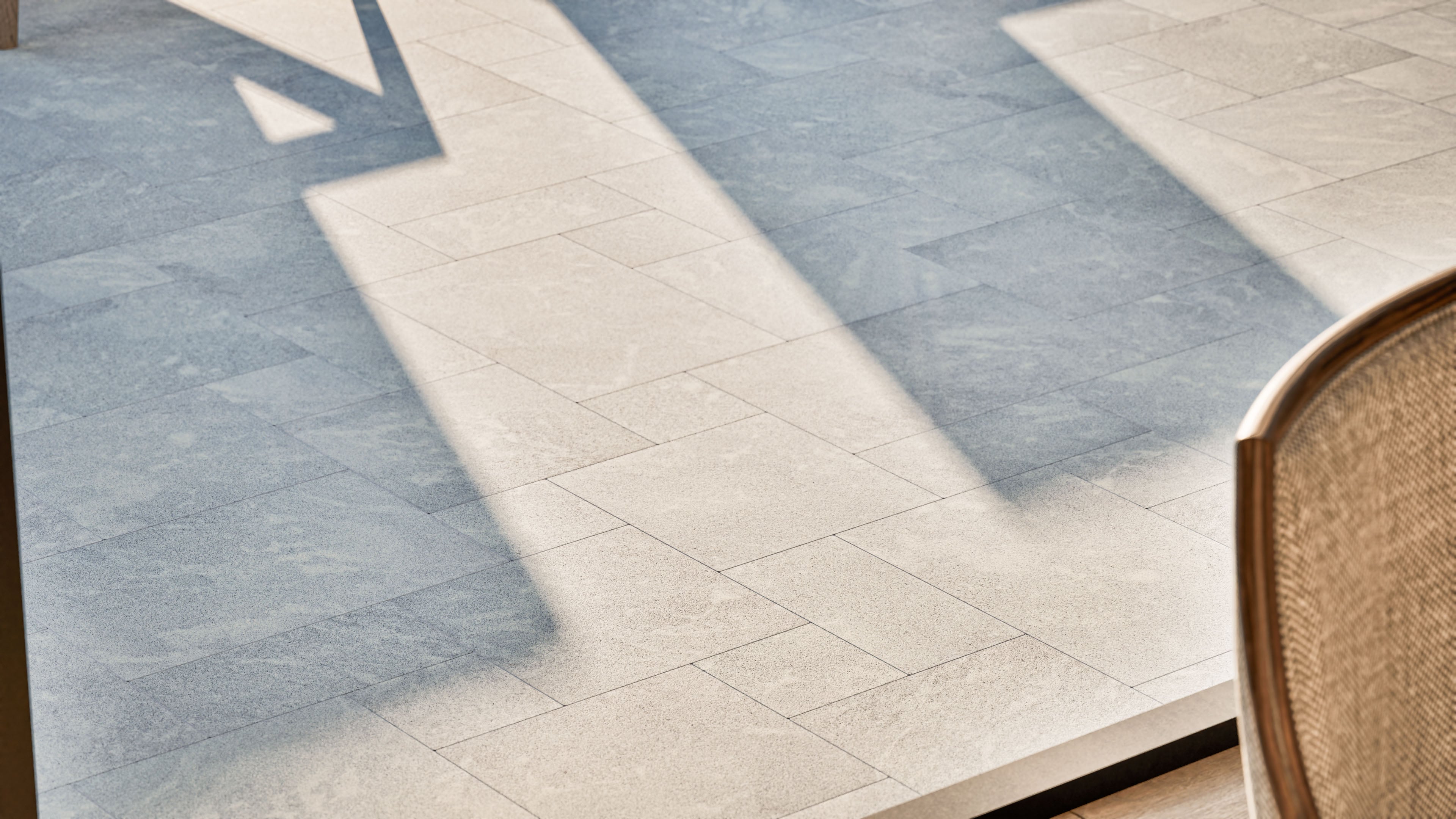 Design visualization of Afyon Grey Marble French Pattern pavers in a contemporary pool and outdoor living setting, showing the collection's light cool-grey tone and soft blue-grey movement.