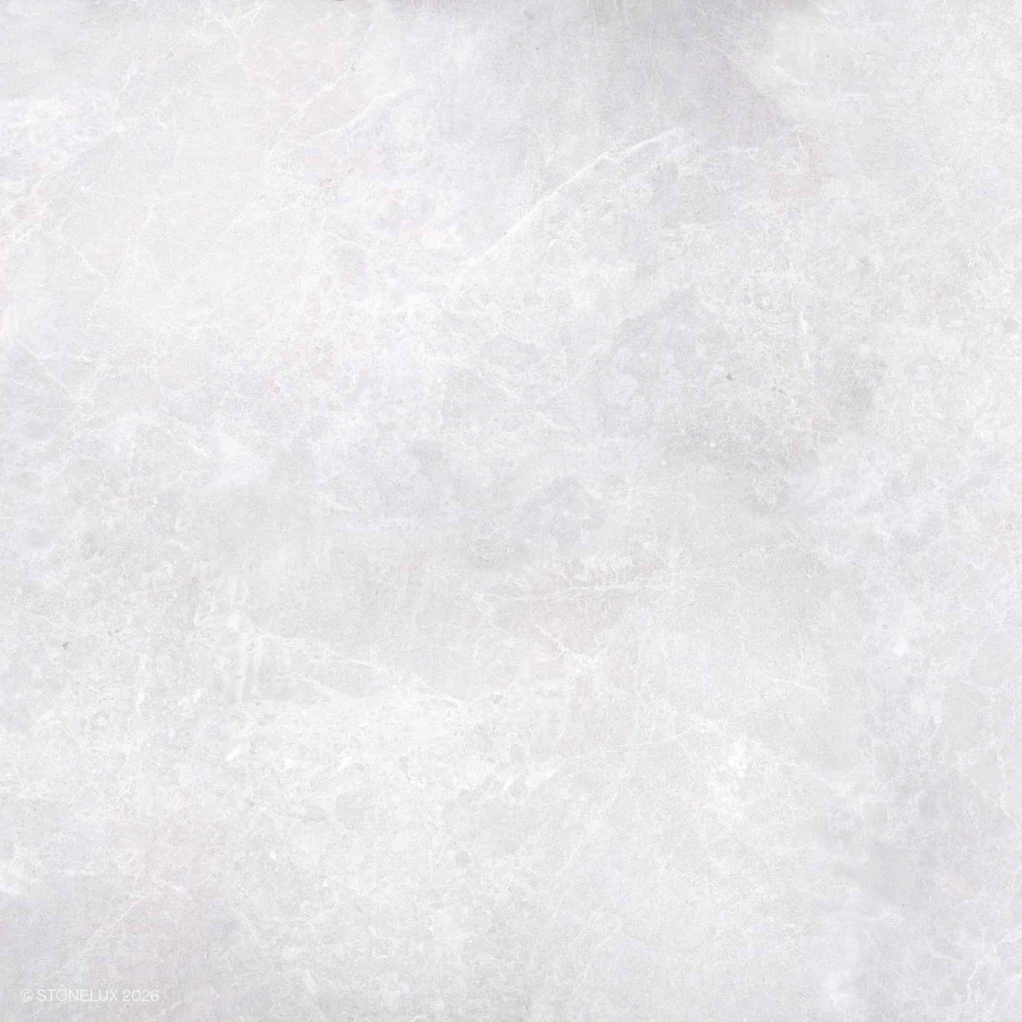 Close-up of STONELUX Pera Cream Marble showcasing its smooth, creamy beige surface with subtle veining. This natural stone offers a refined texture ideal for elegant hardscape projects and pool builds. Perfect for luxurious and sophisticated designs.