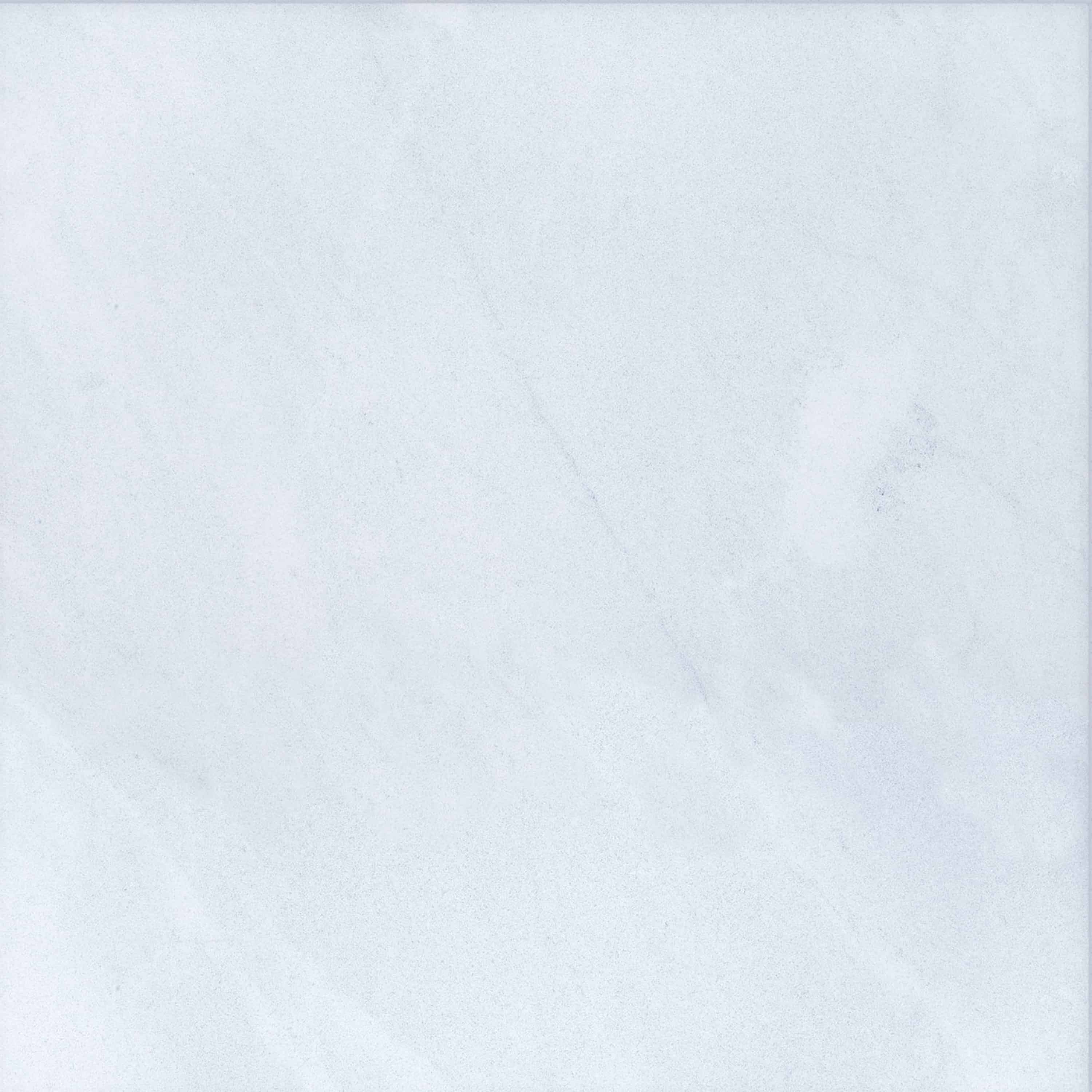 Close-up of Afyon White Marble by STONELUX, showcasing its smooth surface with subtle grey veining and a refined white texture. Ideal for luxury hardscape projects, this natural stone exudes elegance and timeless beauty. Perfect for pool builds and ren...