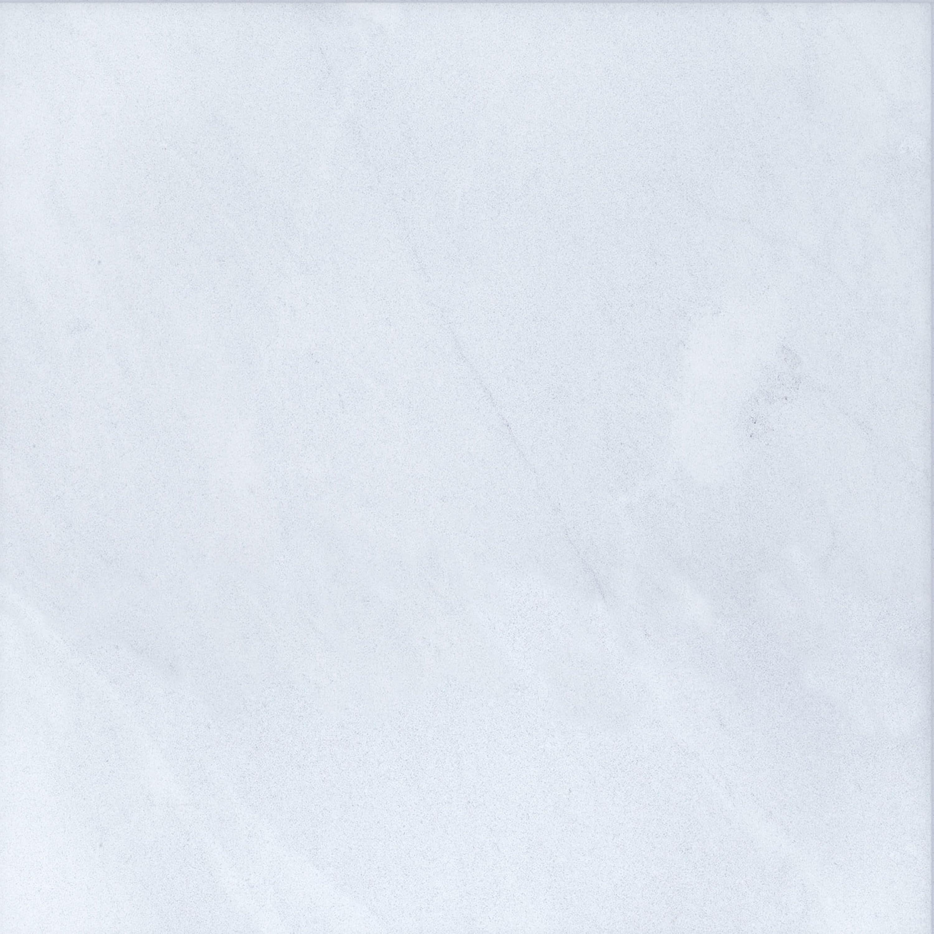 Close-up of Afyon White Marble by STONELUX, showcasing its smooth surface with subtle grey veining and a refined white texture. Ideal for luxury hardscape projects, this natural stone exudes elegance and timeless beauty. Perfect for pool builds and ren...