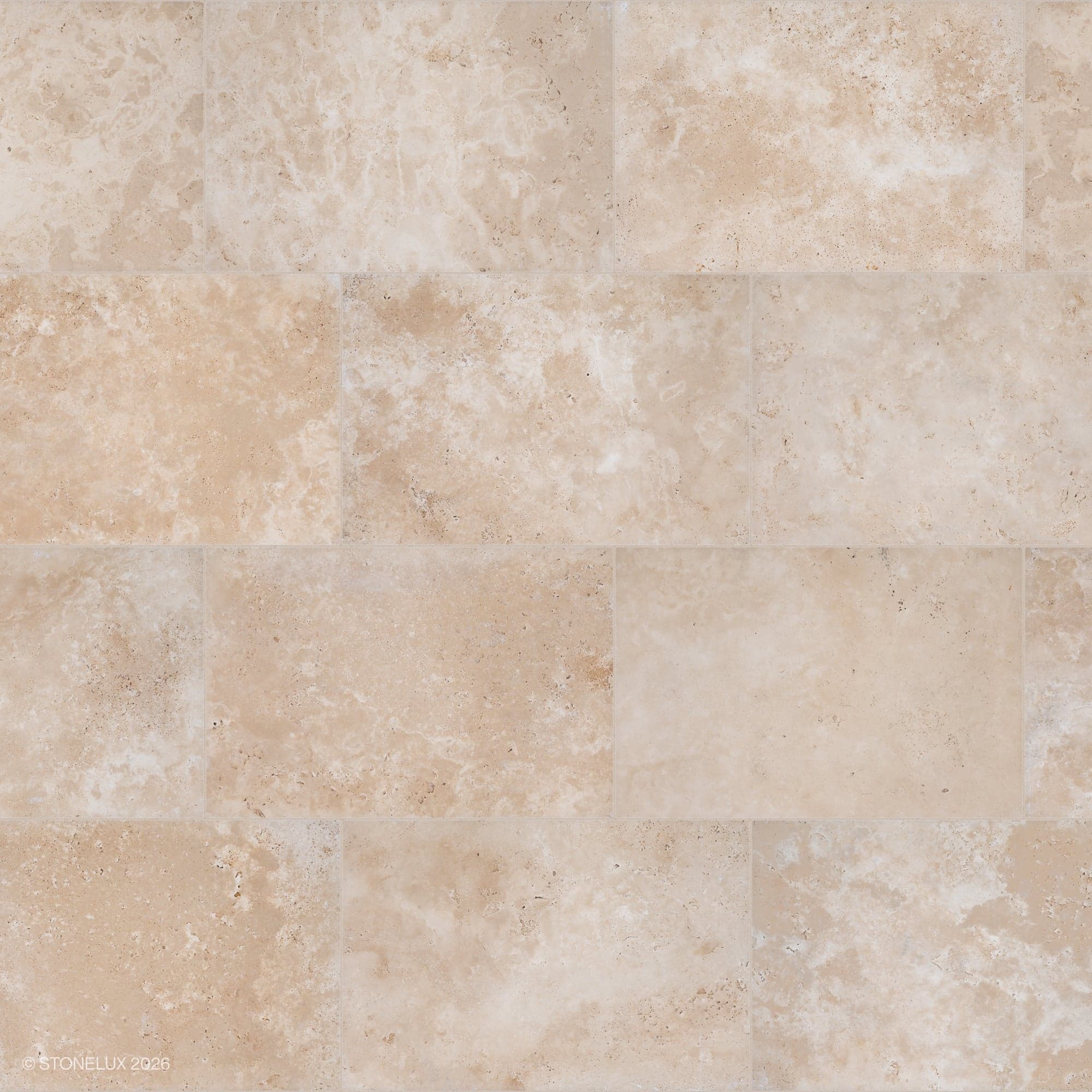 Close-up of Stonelux Ivory Travertine Tumbled 16x24 3cm Paver, showcasing a smooth, tumbled finish with natural beige and cream tones. The travertine paver features subtle veining and a textured surface, ideal for elegant outdoor hardscaping projects.
