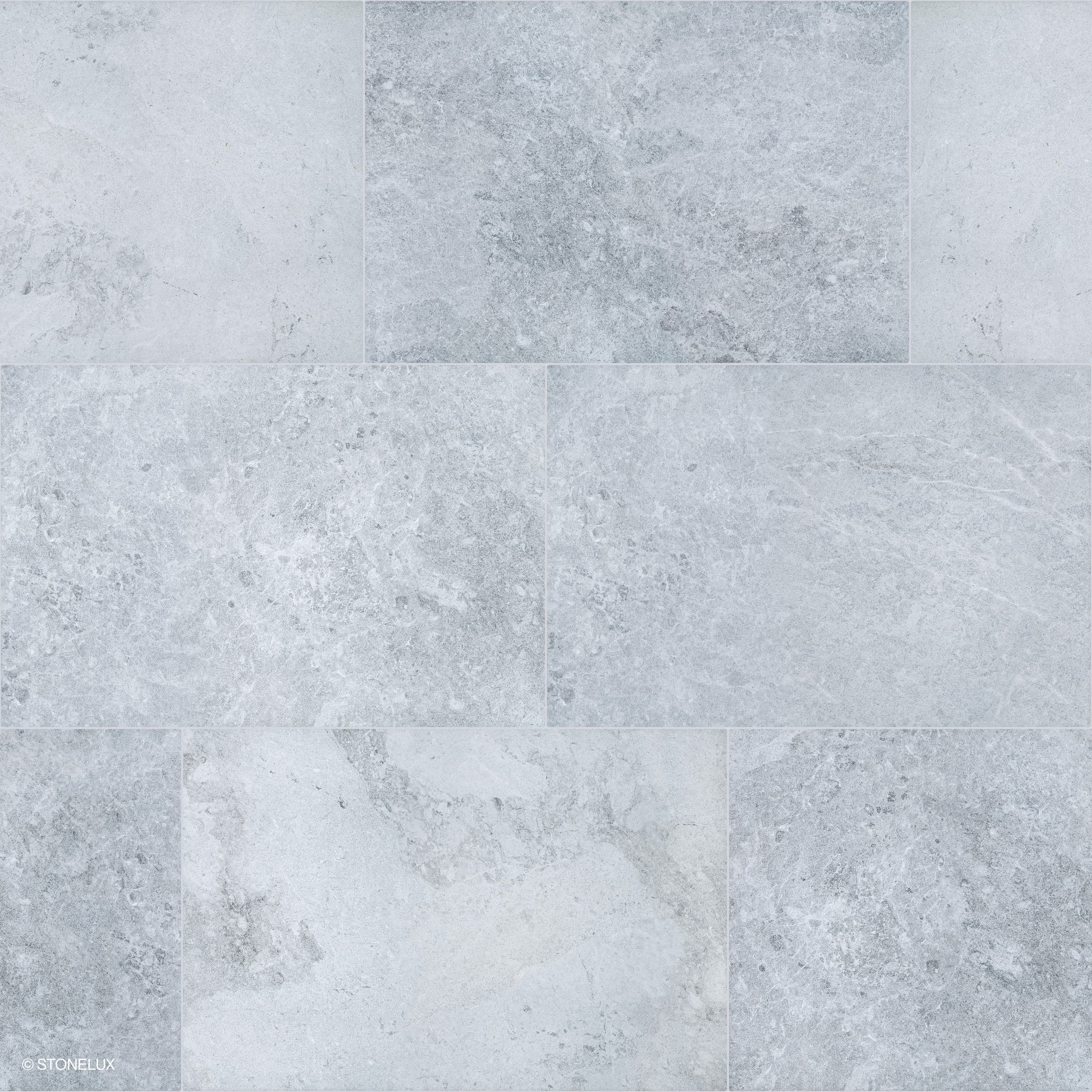 Close-up of Tundra Grey Marble Sand Blasted 16x24 3cm Paver by STONELUX. Features a subtle grey palette with intricate veining and a sandblasted finish, ideal for modern hardscape projects. Durable marble surface, perfect for patios and pool decks.