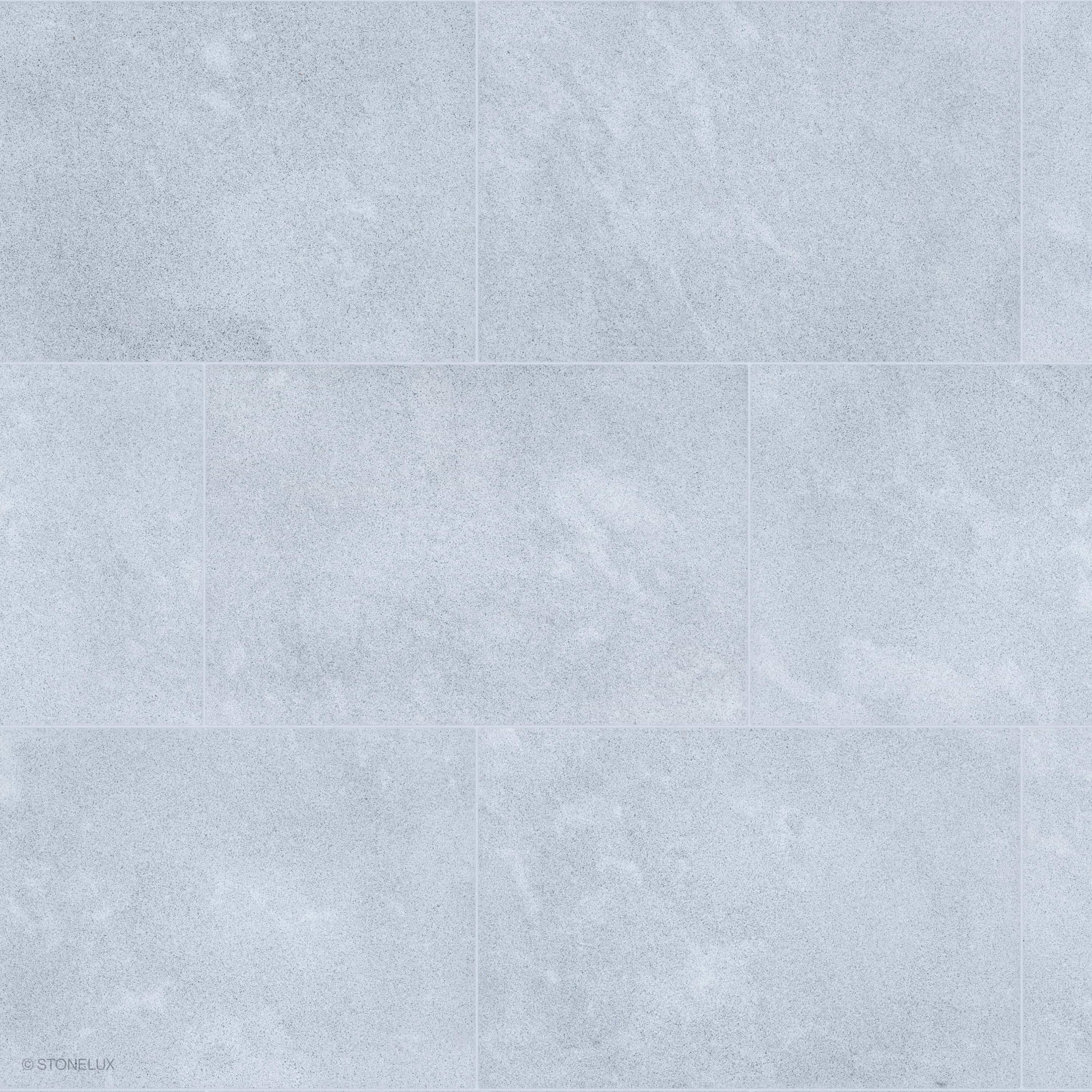 Product view of Afyon Grey Marble Sand Blasted 16x24 3cm Paver, showing a light cool-grey marble surface with fine blue-grey speckling, soft cloudy movement, and its textured finish.