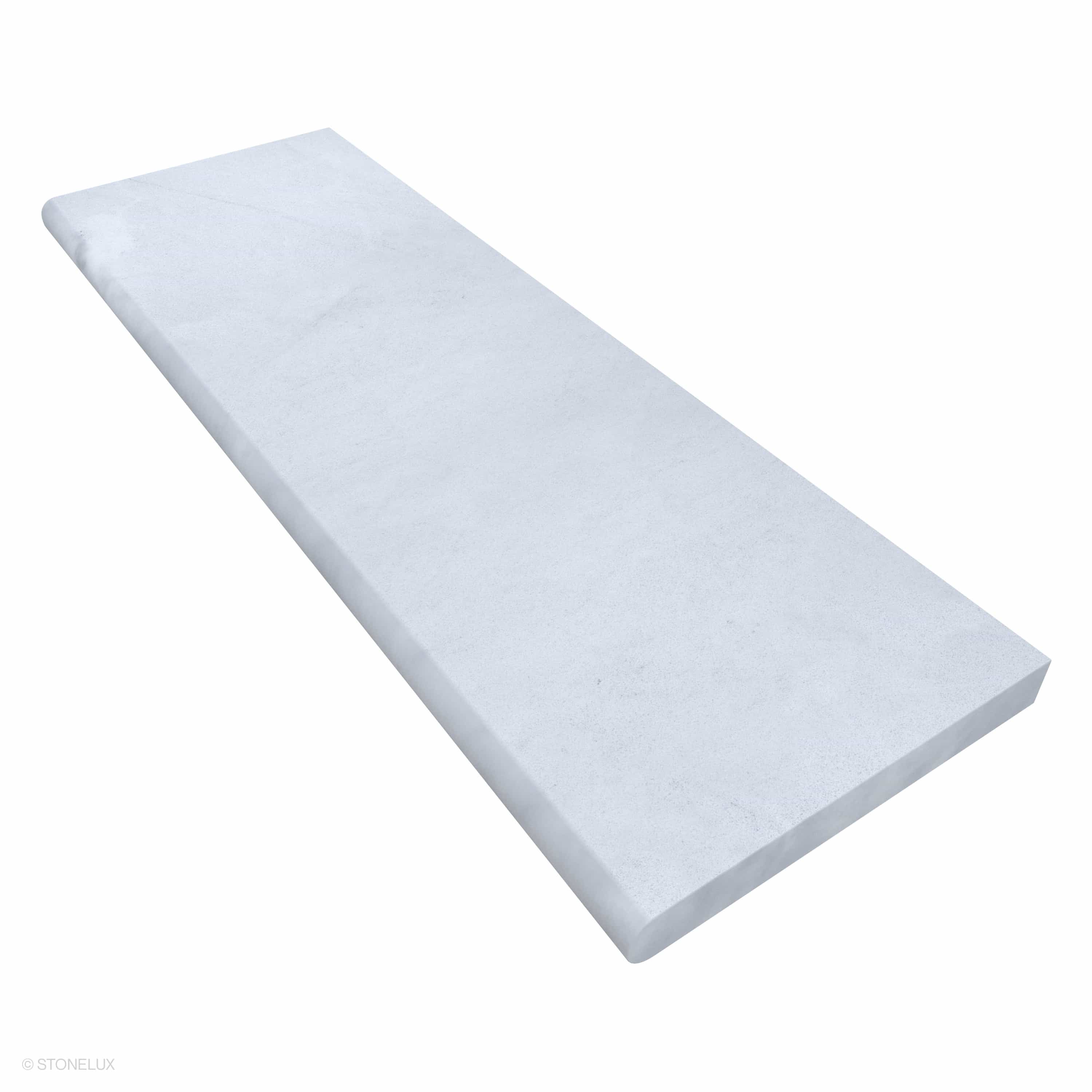 Close-up of Afyon White Marble Sand Blasted 16x48x2 Single Bullnose Coping from STONELUX. The marble features a smooth, sandblasted texture with subtle white veining, ideal for pool edges or wall caps. Its long, elegant design ensures a modern, seamles...