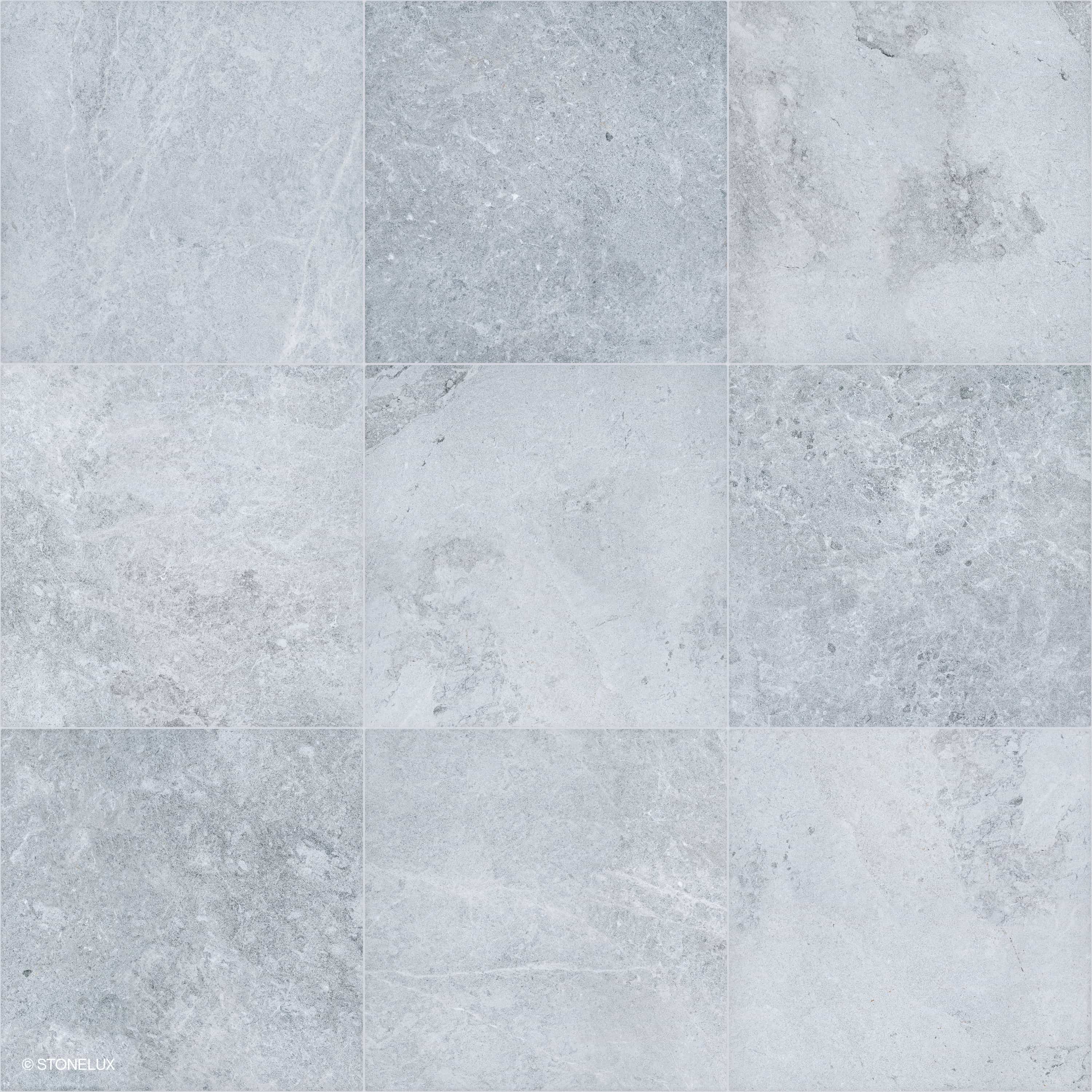 Close-up of Tundra Grey Marble Sand Blasted 24x24 3cm Paver by STONELUX, showcasing a refined sandblasted finish. The marble features subtle grey tones with delicate veining, ideal for sophisticated hardscape designs and poolside installations.
