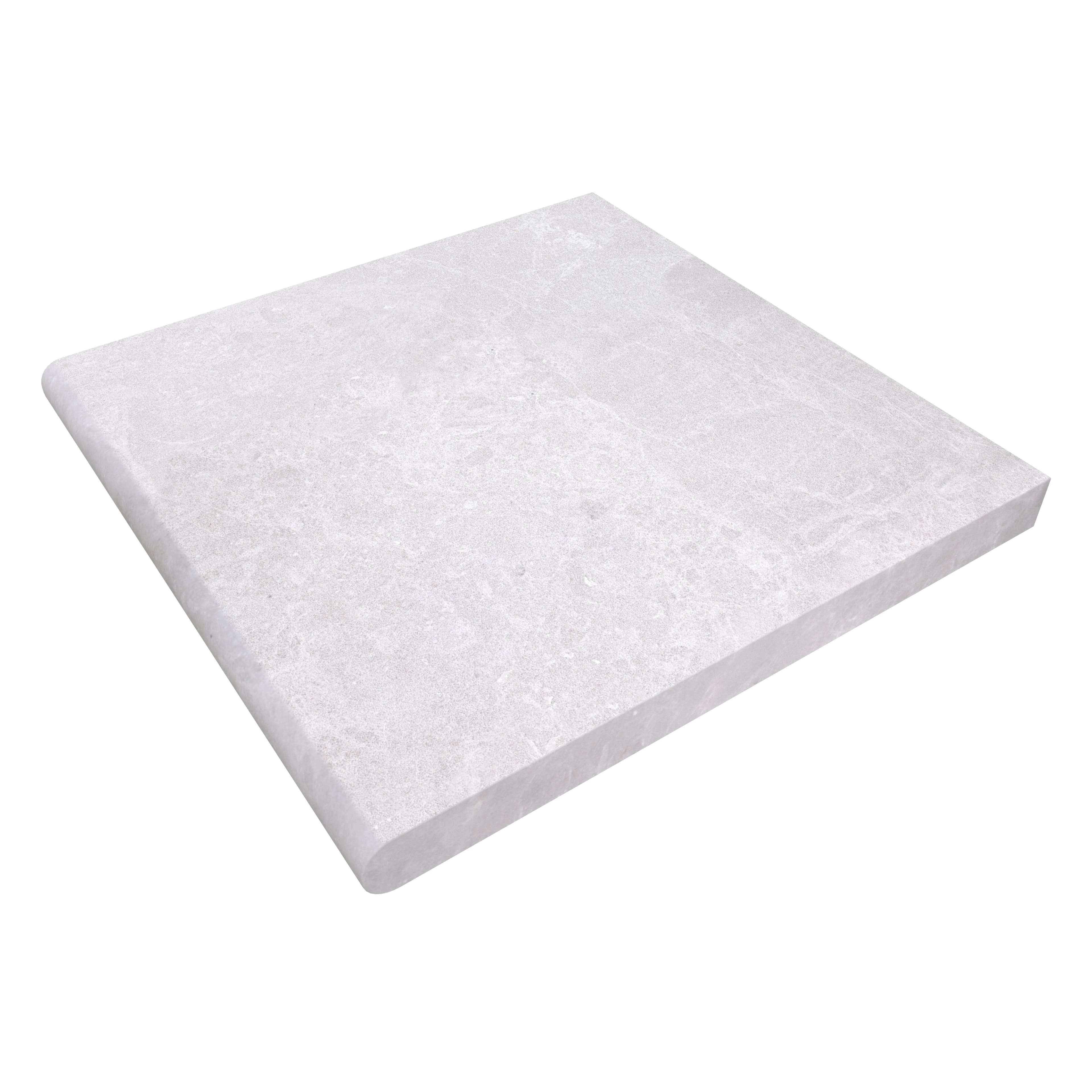 Close-up of the Pera Cream Marble Sand Blasted 24x24x2 Single Bullnose Coping by STONELUX. The marble features a soft cream color with subtle veining, sandblasted finish, and a smooth bullnose profile, ideal for pool edges and step landings.