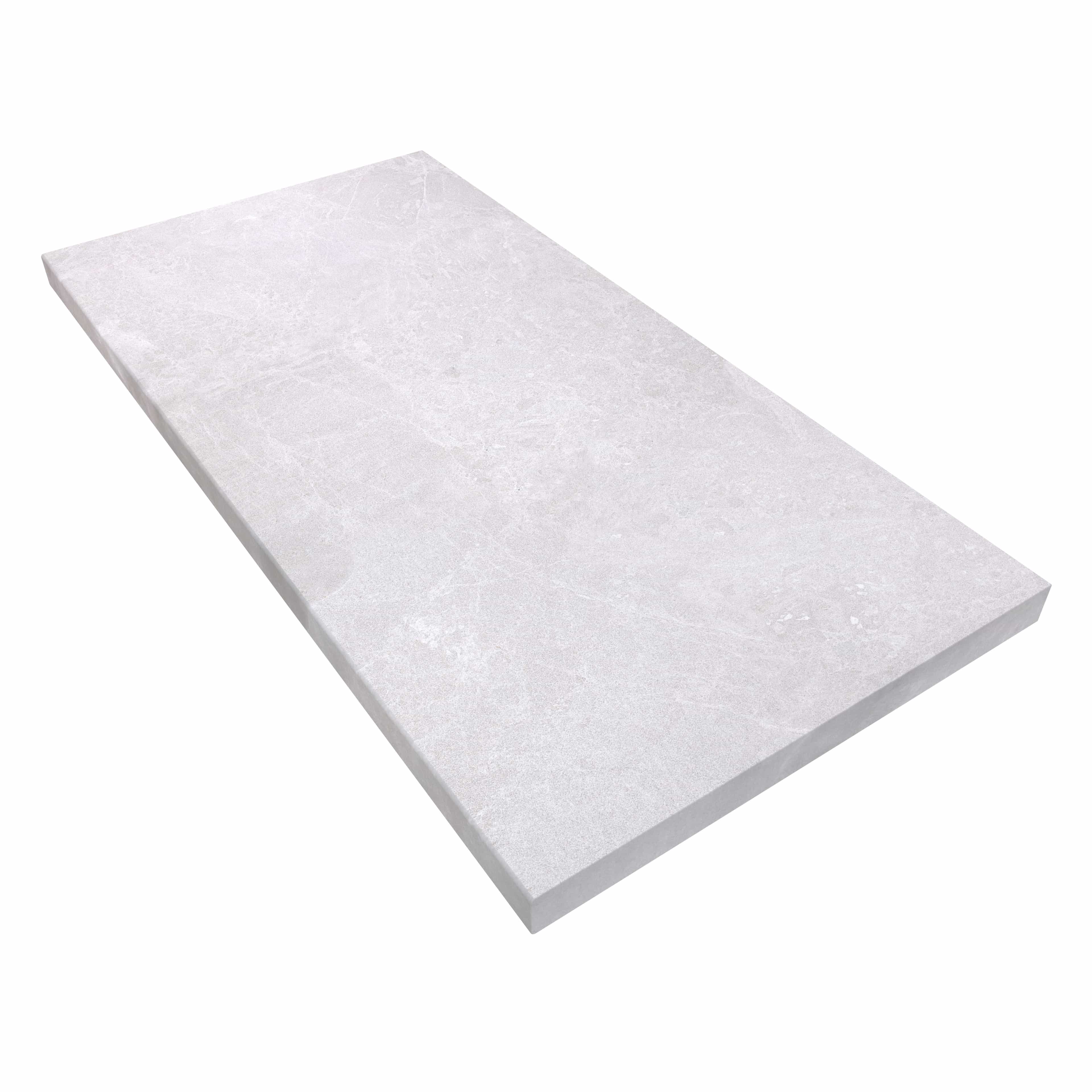 Close-up of the Pera Cream Marble Sand Blasted 24x48x2 Eased Edge Coping. This marble piece features a sandblasted finish with a light cream hue and subtle veining, ideal for pool edges or wall caps. Its 2-inch thickness and eased edge provide a sleek,...