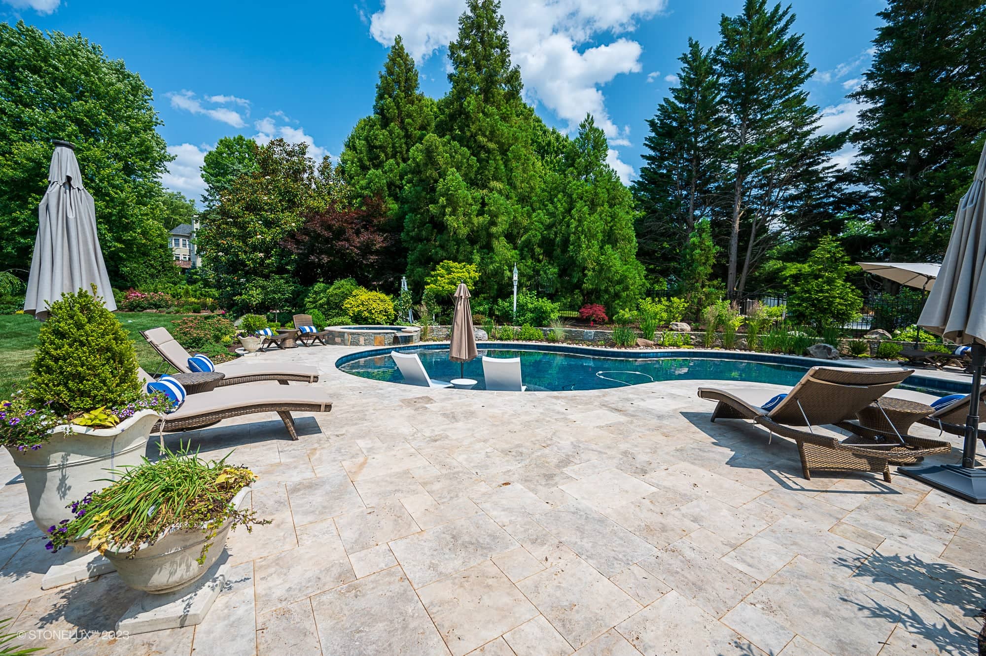 Travertine Serenity: A Poolside Palette of Beige, Brown, and Silver