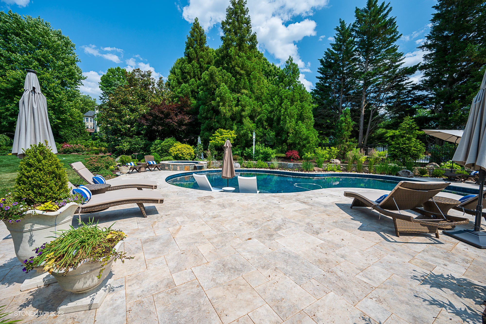 Travertine Serenity: A Poolside Palette of Beige, Brown, and Silver