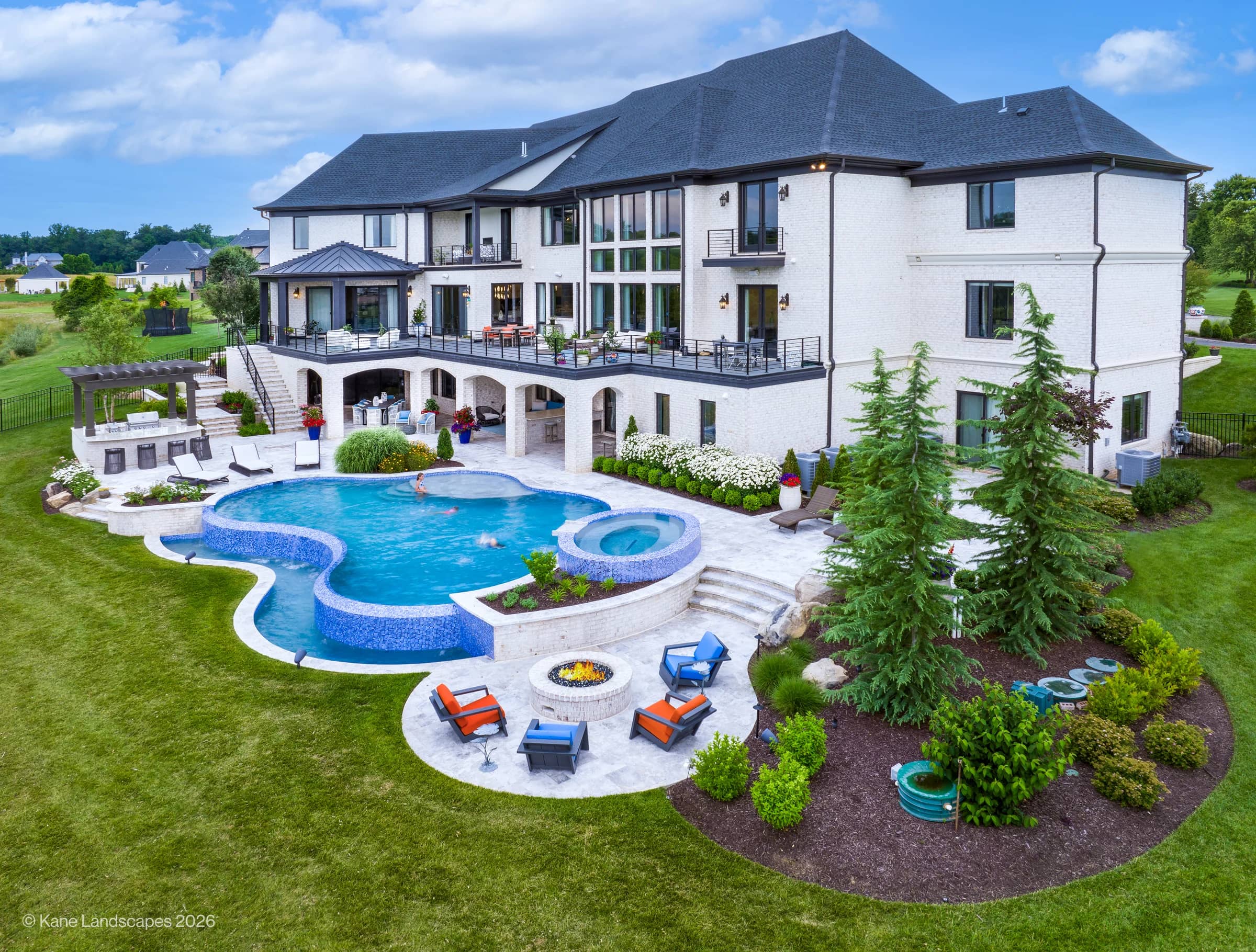 Tundra Grey Marble Pool Terrace with a Pergola-Covered Kitchen