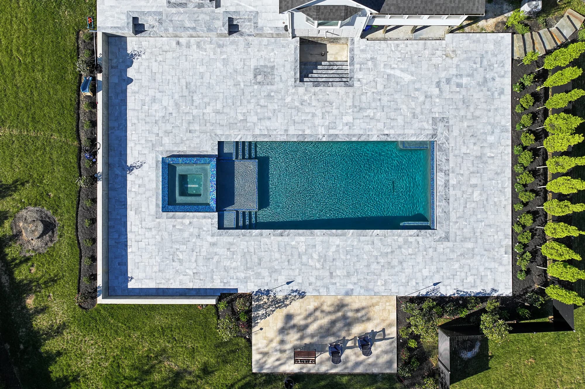 Arctic Retreat: Luxury Pool and Patio with Arctic Grey Marble Pavers - Project Photo